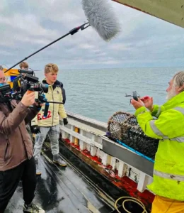 filming-at-sea-crew-studio-production.webp